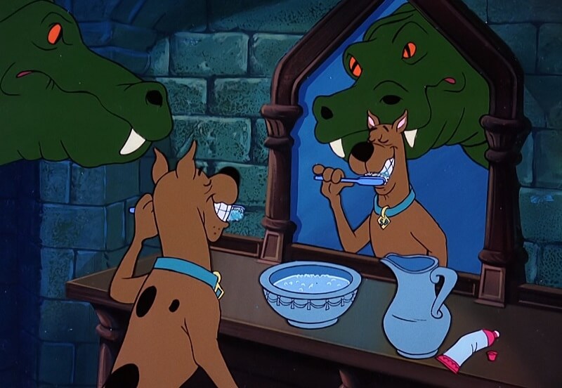 Scooby Brushing Teeth as Lochness Monster Watches