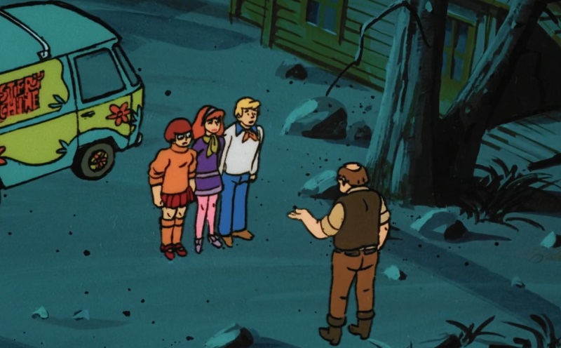 Mr. Moss talking to Freddy and Daphne and Velma