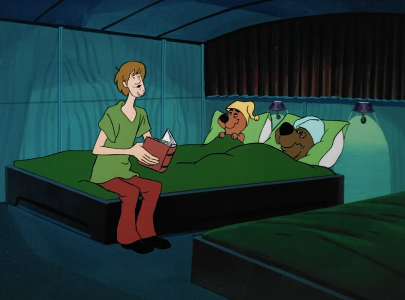 Shaggy reading Scooby a bed time story