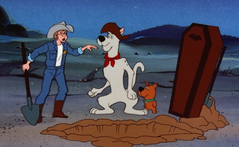 Yabba-Doo pointing at a coffin