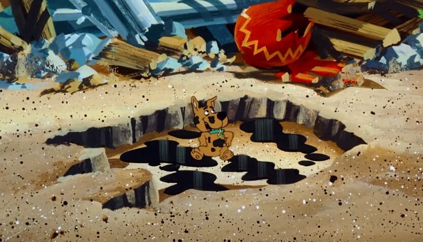 Scrappy in dinosaur footprint