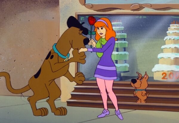 Scooby hands Daphne a Rose