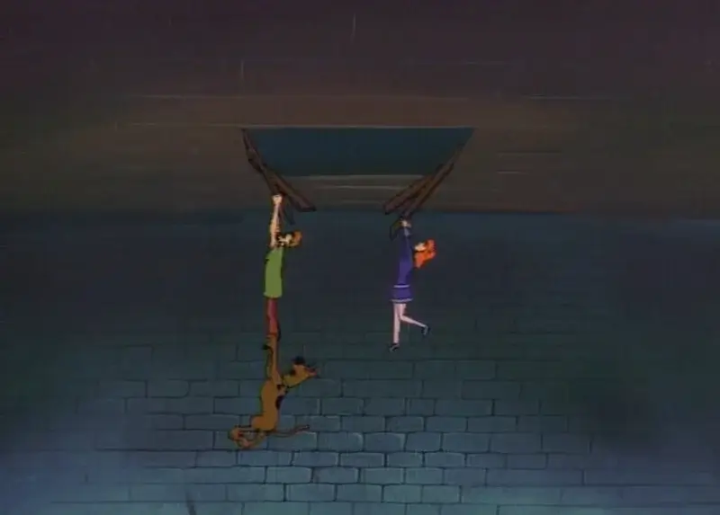Scooby, Shaggy and Daphne holding on for dear life.